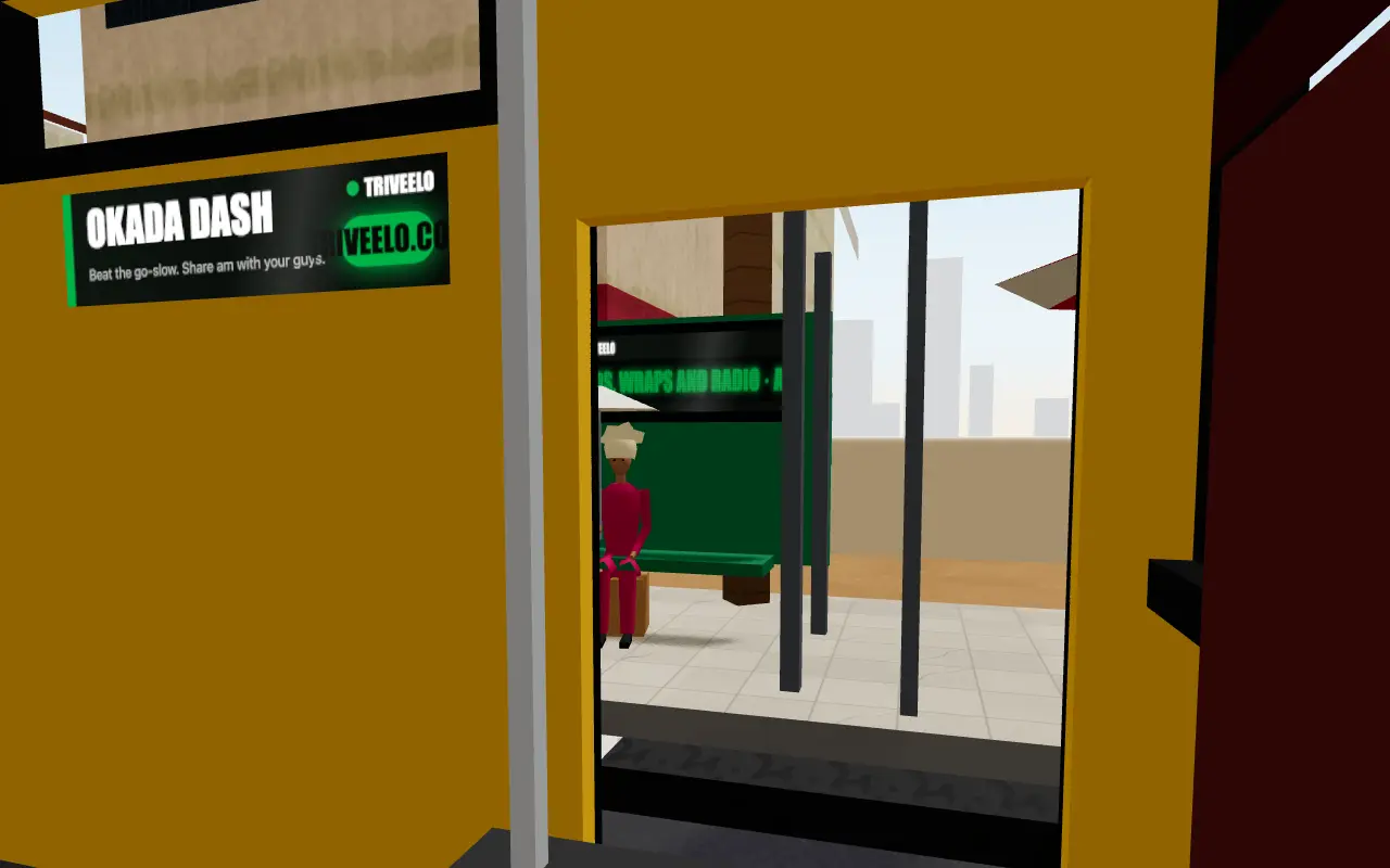 Change Dey: from inside the danfo, an advert panel above the window